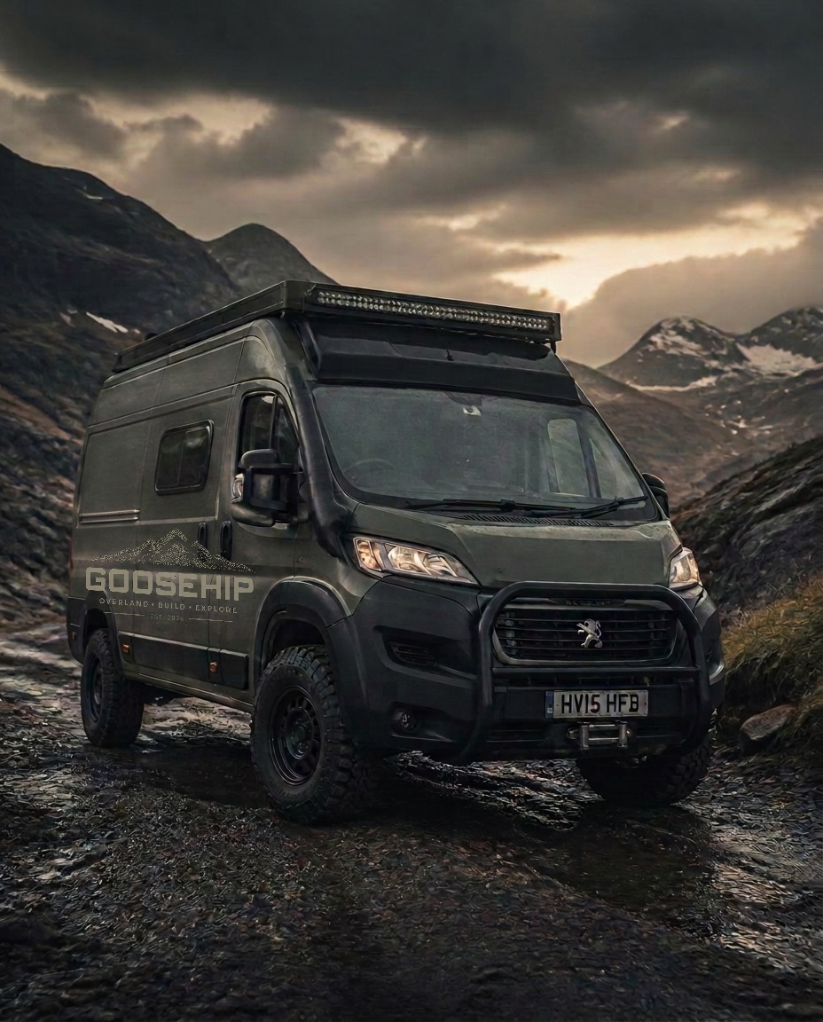 Lifted Peugeot Boxer overlander conversion on a mountain trail at dusk